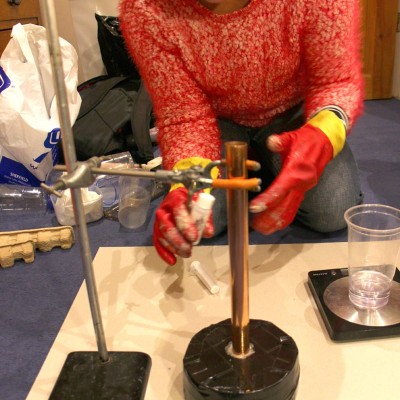 Using a chemistry lab test tube stand to support the copper pipe